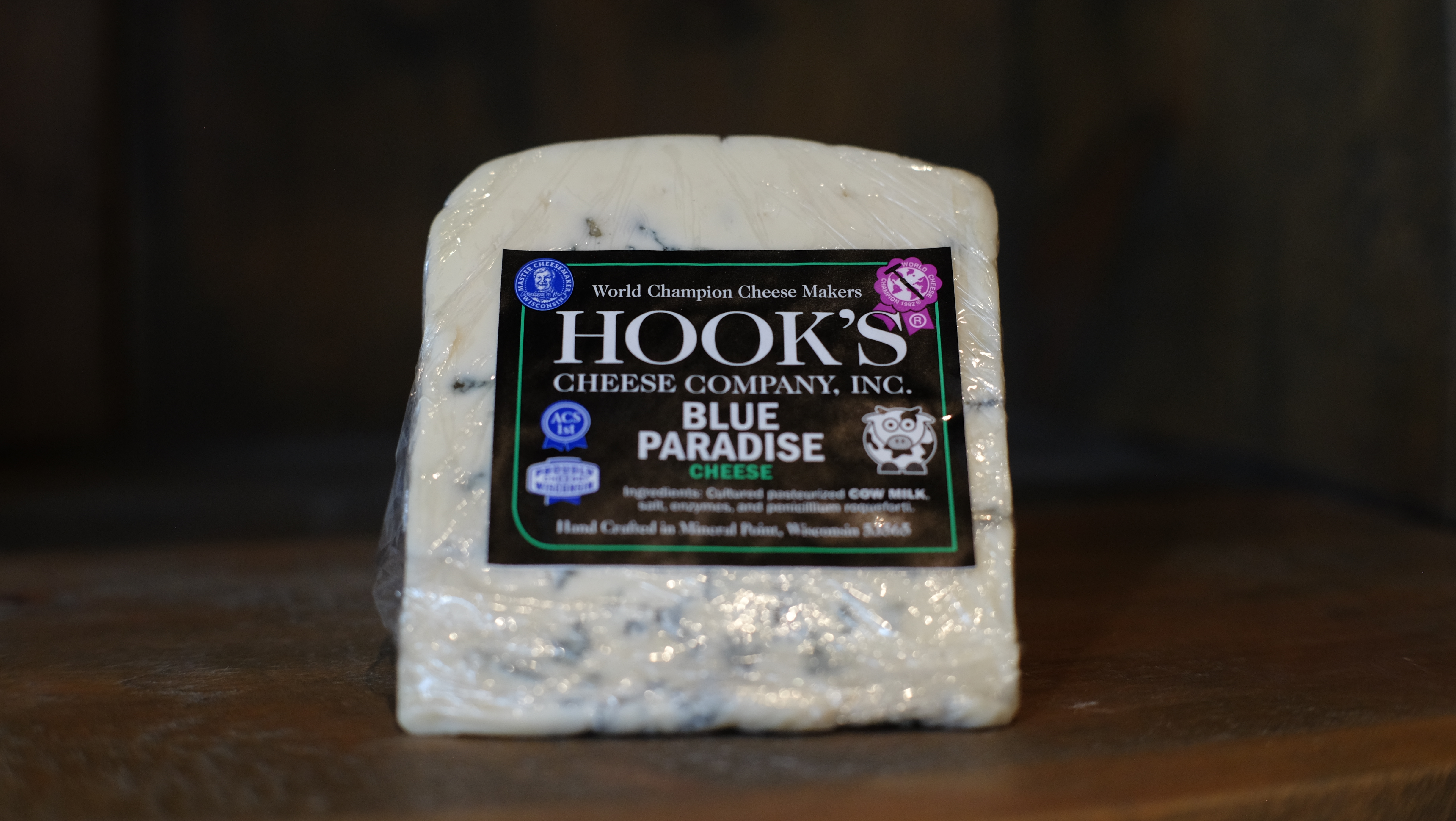 Wedge of Blue Paradise double-cream blue cheese on a board
